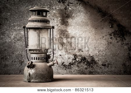 still life of old hurricane lamp