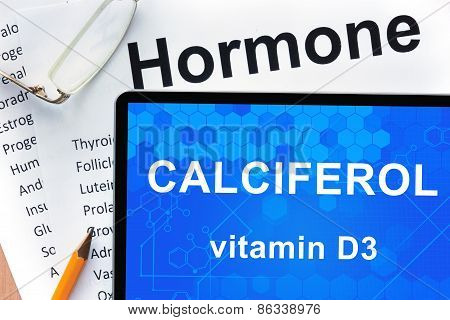 Papers with hormones list and tablet  with words Calciferol (vitamin D3) .