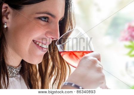 Attractive Girl Enjoying Glass Of Wine.