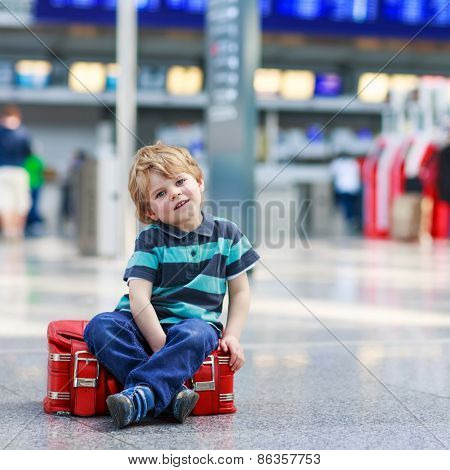 Little Boy Going On Vacations Trip With Suitcase At Airport