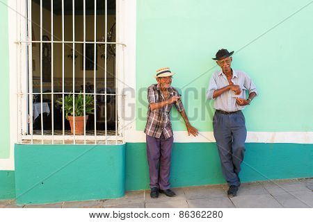 Trinidad - February 24: Unknown People Smoking Cigar On Street Of Trinidad On February 24, 2015 In T