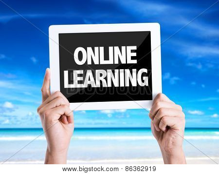 Tablet pc with text Online Learning with beach background