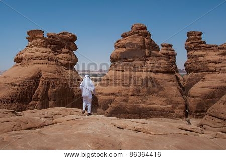 Saudian Walking On Top Of Rock Formations, Saudi Arabia