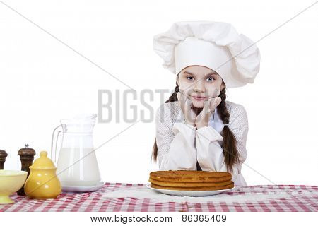 Cooking and people concept - smiling little girl in cook hat, isolated on white background