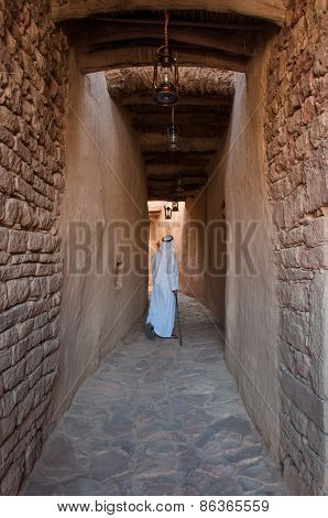 Saudian Walking Inside The Walls Of Al-ula Old City, Saudi Arabia