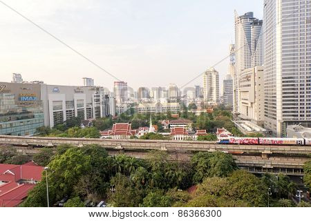 Bangkok,thailand-february 17:bangkok Mass Transit System (bts) Pass The Pathumwanaram Temple At Siam