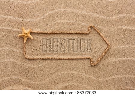 Arrow Made Of Rope And Starfish With The Word Larvotto On The Sand