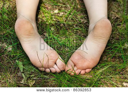 Feet Of Little Girl Outdoors