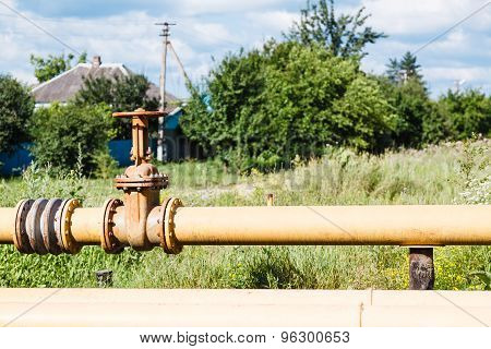 Gas Pipeline In Village In Summer Day