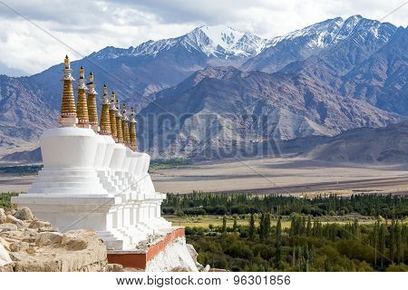 Buddhist Stupa And Himalayas Mountains . Shey Palace In Ladakh, India