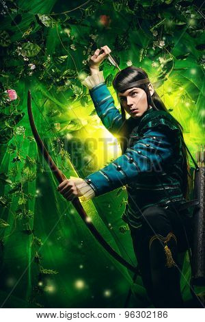 Portrait of a male elf with a bow and arrows in a magical forest.
