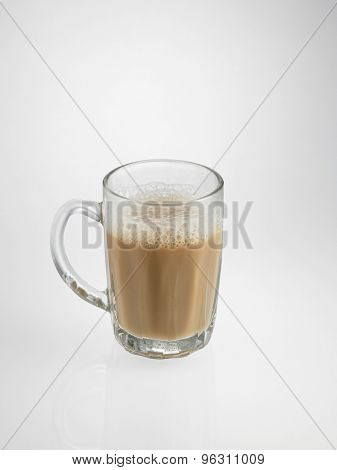 Half glass of Tea with milk or Teh Tarik in Malaysia