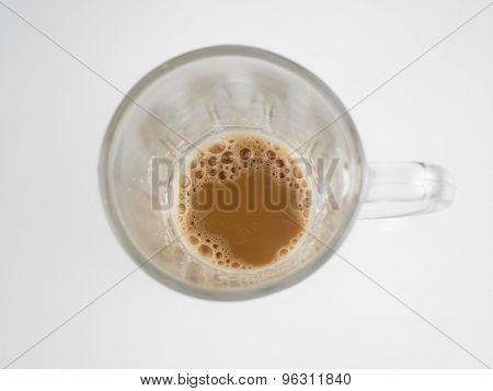 Top view of lnearly empth glass with little Tea with milk or Teh Tarik in Malaysia