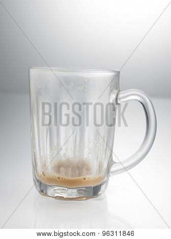 glass with little Tea with milk or Teh Tarik in Malaysia