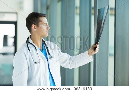 intern doctor looking at patient's x-ray at hospital
