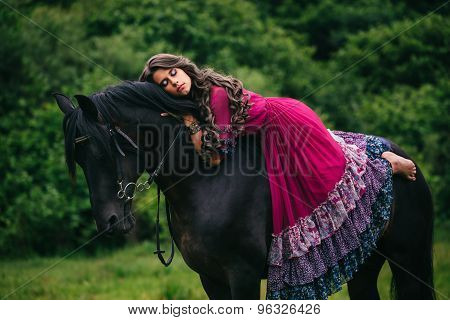 Beautiful gypsy in violet dress