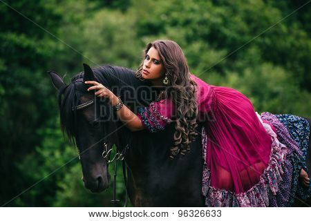 Beautiful gypsy in violet dress