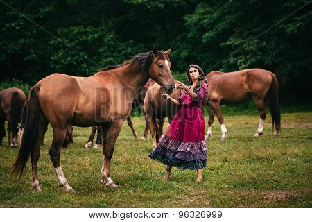 Beautiful gypsy in violet dress