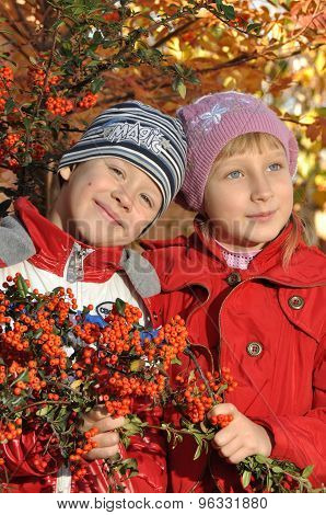 A boy with a girl near rowan