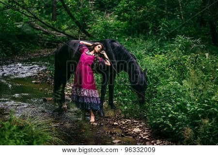 Beautiful gypsy in violet dress