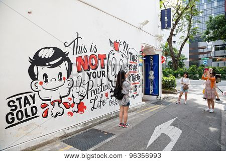 SINGAPORE - CIRCA FEBRUARY, 2015: Graffiti on the walls of old buildings Haji Lane. Haji Lane is the Kampong Glam (Arab Quarter) neighbourhood famous for its cafes, restaurants and shops.