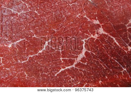 fresh raw red beef meat big steak chunk on wooden cut board isolated over white background