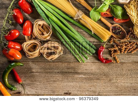Italian food background with space for text  on wooden table