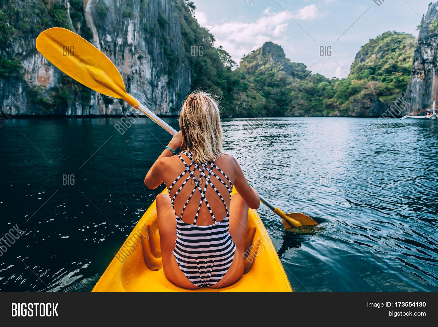 woman paddling kayak image photo free trial bigstock