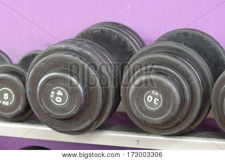 The image of wights in a fitness hall