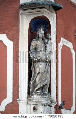 PTUJ, SLOVENIA - JULY 02: Virgin Mary with baby Jesus, statue on the house facade in Ptuj, town on the Drava River banks, Lower Styria Region, Slovenia on July 02, 2016.