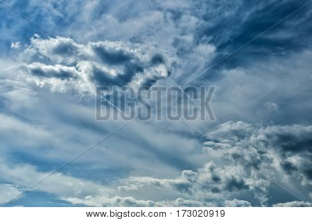 the storm sky with various shades of blue color and white clouds