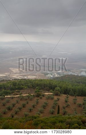 View of the Jezreel Valley in fog in winter cloudy day from Muhraqa on Mount Carmel in Lower Galilee Israel