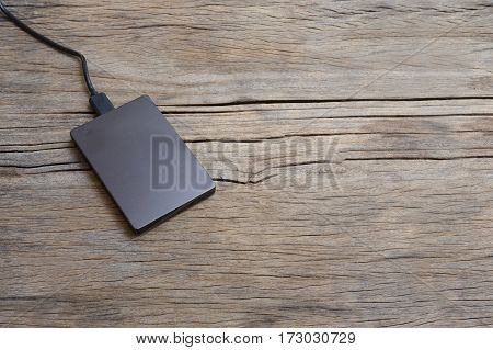 External Hard Drivve With Usb Post On Wooden Background