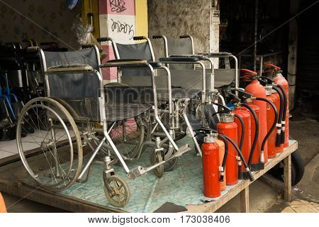 a store selling wheelchairs and fire extinguishers with red tube photo taken in Depok Indonesia java