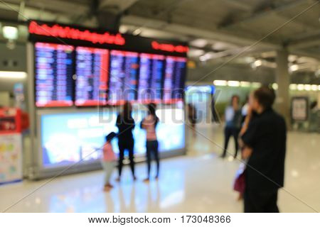 Blurred Image Of Business People In International Airport Terminal, Looking At Information Board, Ch