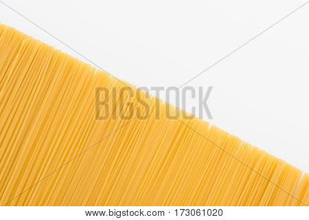 top view of raw vermicelli for making pasta on white