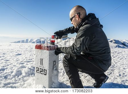Tourist Glasses Poured From A Thermos With Hot Tea In The Winter In The Mountains.