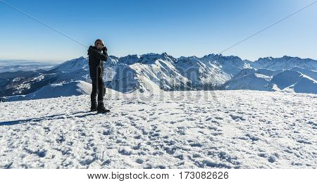 Tourist Glasses Drinking Hot Tea In Winter In The Mountains.