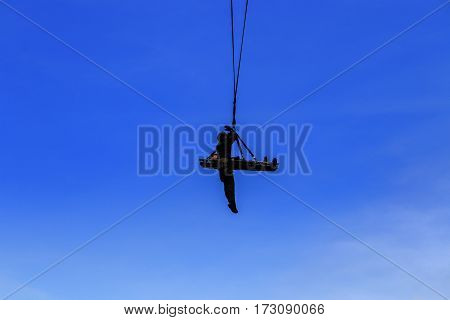 silhouette Soldier rescue emergency by army helicopter with rope on blue sky