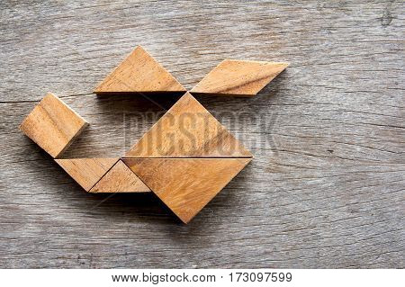 Wooden tangram puzzle in helicopter shape background