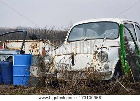 Closeup of the front part of an old abandoned car