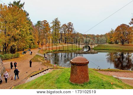 Beautiful romantic alley in a park with colorful trees and sunlight. autumn natural background Gatchina