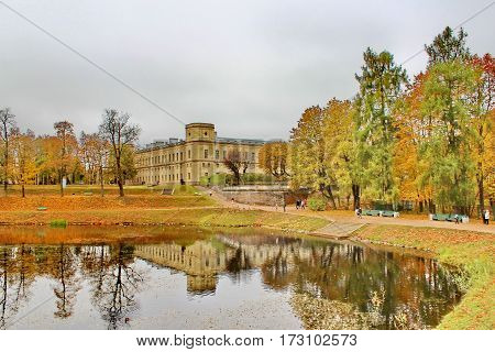 Beautiful romantic alley in a park with colorful trees and sunlight. autumn natural background Gatchina