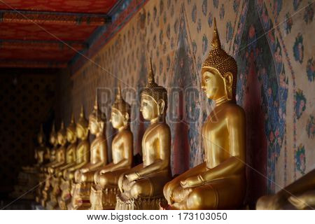 Golden buddha statue on temple Bangkok, Thailand.