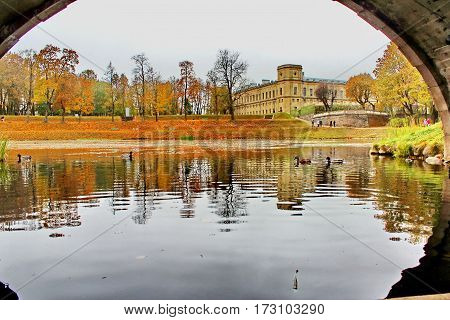 Beautiful romantic alley in a park with colorful trees and sunlight. autumn natural background Gatchina