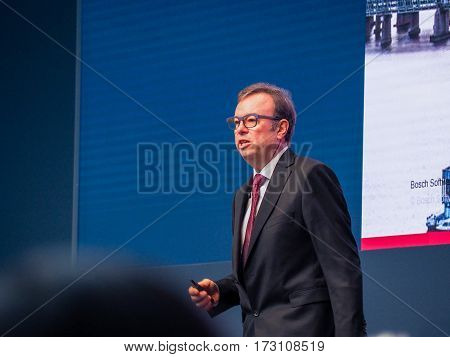MUNICH GERMANY - FEBRUARY 16 2017: Bosch Software Innovations CEO Rainer Kallenbach delivers an address to IBM Genius of Things Summit in Munich Germany on February 16 2017.