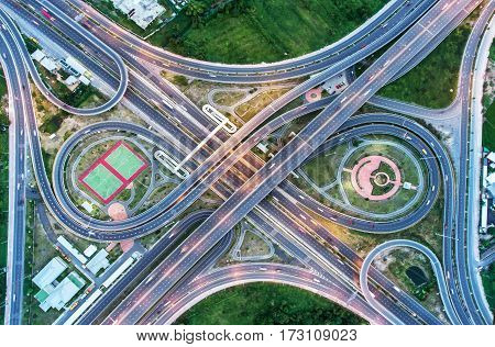 The light on the road roundabout at night and the city in Bangkok Thailand. Aerial view Top view.Light scenic road. cityscape Rush hour traffic jam