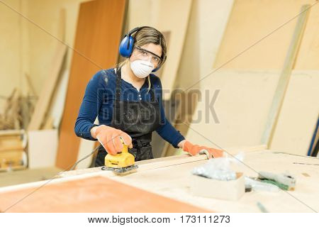 Woman Working In A Wood Shop
