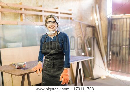 Beautiful Female Carpenter In A Woodshop