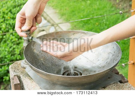 dirty hand , wash hand on park